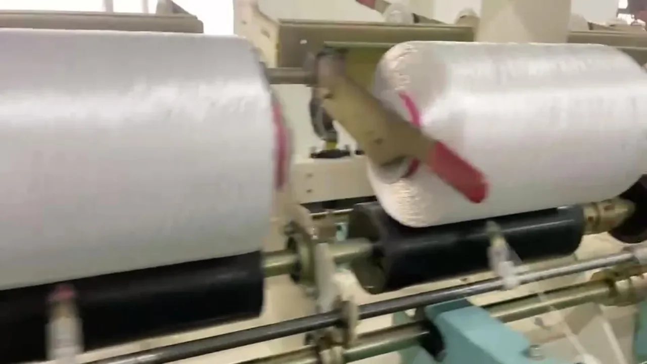 PE filament running over winding rollers in a partner mill