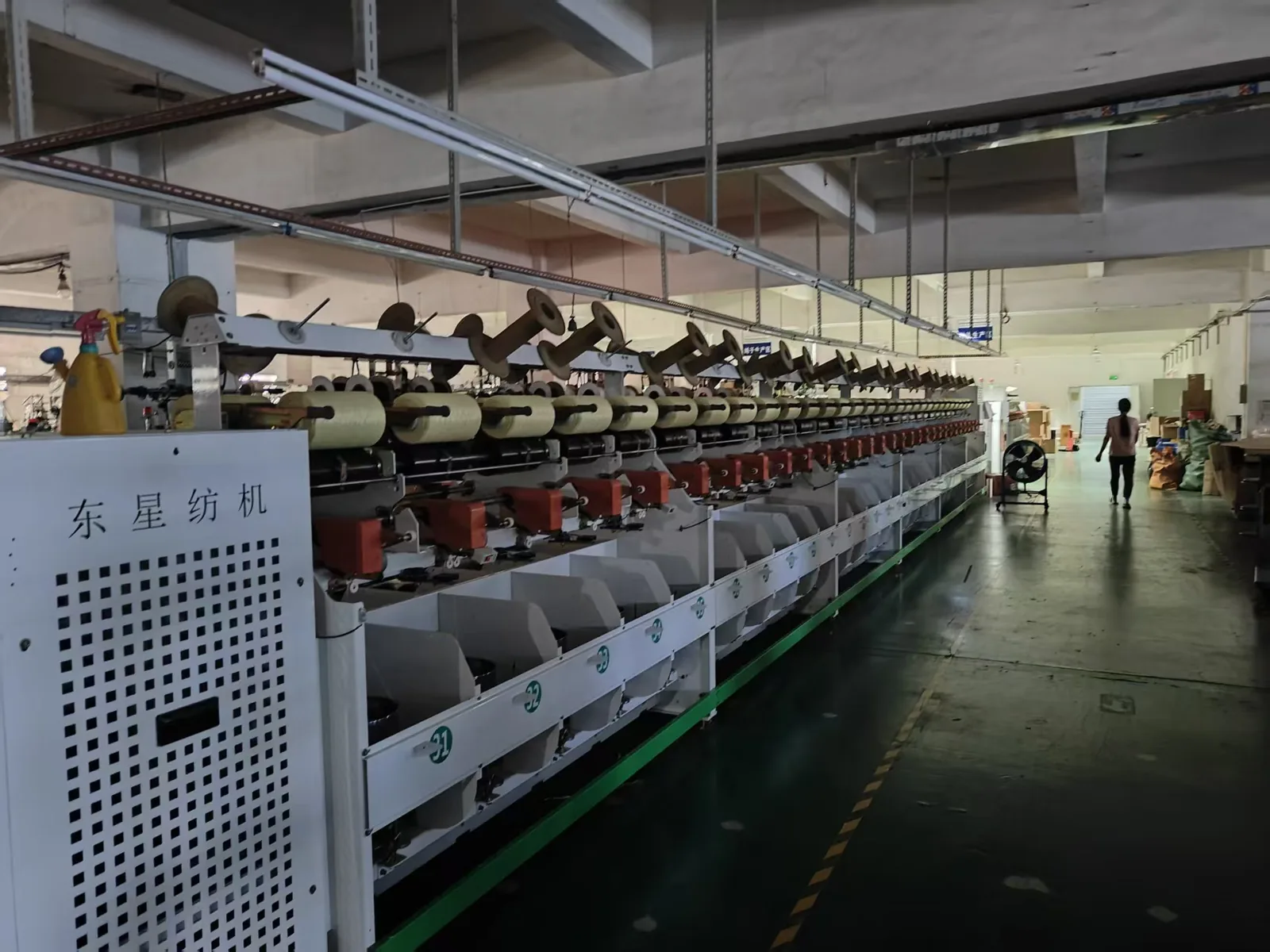 Raw-yarn production line inside a partner mill